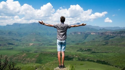 man on top of mountain